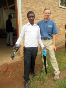 Gift, with Elisha, receiving his carpentry tools.